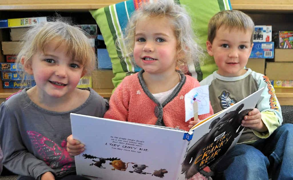 Enjoying the adventures of The Very Cranky Bear as part of Simultaneous Storytime are Katey Going, 3, Isobel Lewis, 2, and William Sollars, 4. Enjoying the adventures of The Very Cranky Bear as part of Simultaneous Storytime are Katey Going, 3, Isobel Lewis, 2, and William Sollars, 4.